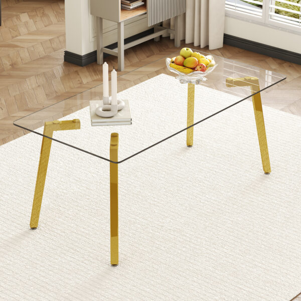 00b0d3971510421893f944495de40da8_d8598fdd7e47a1c36c6250c6155c21d5 71 * 35.4 inch rectangular dining table. The transparent tempered glass tabletop is paired with golden 7-shaped metal table legs, showcasing a minimalist texture. Suitable for various places.