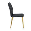 Four black dining chairs. A medieval modern chair made of PU material with soft cushions, equipped with golden metal legs. Suitable for restaurants and living rooms