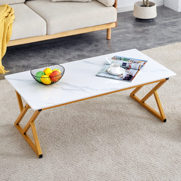 08a83ec0c636406b885b825af82f7cca_43bfb18045b0a10be2886121238015a3 A coffee table made of rock slab material, with a smooth and natural surface that complements the modern design of the golden metal legs, making it suitable for living rooms of all sizes.47*23.6