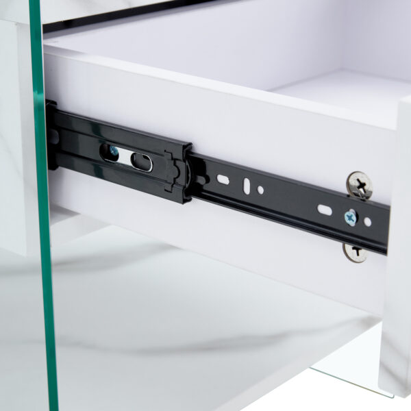 0ba3f3bf98884846a9daa889b16b45e8_bc73fde516b8d6d850a551c64498896a Bedside table with drawers. The board surface is MDF sticker, and both sides are transparent tempered glass. The design is simple and elegant, with excellent storage functions.