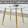 A glass tabletop with a diameter of 40 inches and a modern minimalist circular dining table with gold plated metal legs. 40 '* 40' * 30 ' DT-1164