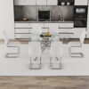 Table and chair set.Modern Luxurious Transparent Tempered Glass Dining Table Set with 6 Chairs.Single fork silver metal table legs.White high-quality PU dining chairs with silver metal legs.