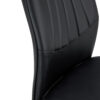 Four black dining chairs. A medieval modern chair made of PU material with soft cushions, equipped with golden metal legs. Suitable for restaurants and living rooms