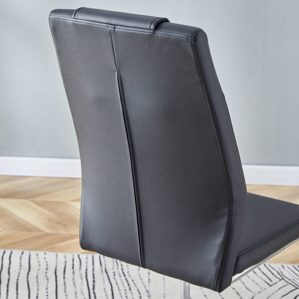 17a65011ba774afd8601a24312e56652_1c5d889711b8c942e1225fa77c347860 Table and chair set.63"x31.5x30" Luxurious Pandora patterned Sintered Stone Tabletop with Silver Stainless Steel Butterfly Legs.Paried With 6 Black High-quality PU Chairs With Arched Metal Legs.