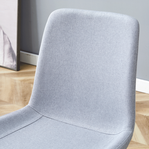 18402a0c4c7941d7832448d00ddcdcc3_bb173848d41fdc90b8477fc95771c214 Table and chair set.A minimalist retro rectangular dining table with a textured top and black metal legs.Paired With 6 Light Gray Linen-Cotton Dining Chairs With Curved Widened Cushion Design.