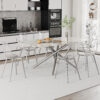 Table and chair set.Modern Luxurious white Marble-Patterned Tempered Glass Dining Table with 6 Transparent Plastic Chairs with silver legs.Single fork silver metal table legs.