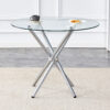 Round clear glass dining table with a unique shape for 4-6 people, with ring-shaped gathered silver metal legs, suitable for desks, kitchens, terraces, dining rooms.