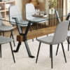Table and chair set.79"x31.5" with X-shaped Black Metal Table Legs,Wood Grain Textured MDF Crossbeam.Paired With 8 Chairs Made Of Light Gray Lnen Fabric.Iron pipe spraying Legs.