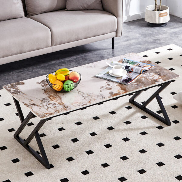 20320bc6dfd249298edfe49eb7824a83_2d3f77f72e911cbb5fd16dca33a2d416 A coffee table is made of rock slab material, with a natural and smooth marble pattern on the surface, which complements the modern design of the black metal legs and adds a touch of fashion.47*23.6