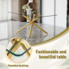 Table and chair set.Modern Luxurious Transparent Tempered Glass Dining Table Set with 6 Chairs.Single Fork Golden Metal Table Legs.Black high-quality PU dining chairs with golden metal legs.