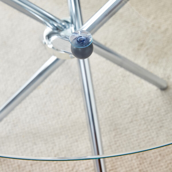228d88f50b784445905f8ab3ef0e01fa_0679e1642dc43f1e12859697a771780c Table and chair set.36.6"Round clear glass dining table with a unique shape with ring-shaped gathered silver metal legs.Paired with 4 Dark gray high-quality PU dining chairs with silver metal legs.