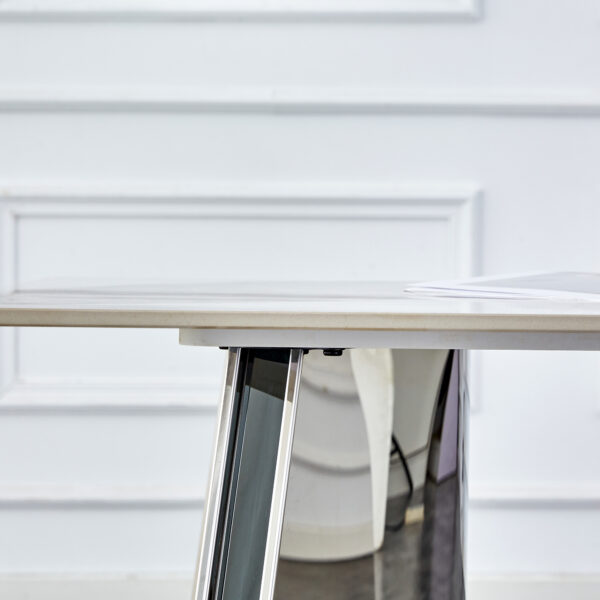 228e321f338e4e89a9317bc32479dff3_a722c7a68d8afc28e3fa08c06cb63c4f Table and chair set.63"x31.5x30" Luxurious Pandora patterned Sintered Stone Tabletop with Silver Stainless Steel Legs.Paried With 4 White PU Chairs with a vertical stripe design on the backrest.