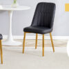 Table and chair set.63"x31.5x30" Luxurious Pandora patterned Sintered Stone Tabletop with Golden Stainless Steel Butterfly Legs.Paried With 4 Black PU Chairs with Simple Line Designs On The Backrest.