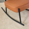 PU material cushioned rocking chair, unique rocking chair, cushioned seat, brown backrest rocking chair, black metal legs. Comfortable side chairs in the living room, bedroom, and office