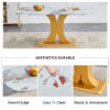A modern minimalist dining table. Imitation marbled glass tabletop. Gold MDF table legs for kitchen and living room
