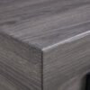 A rustic gray wood grain MDF coffee table with black metal legs - an elegant space in natural wood tones