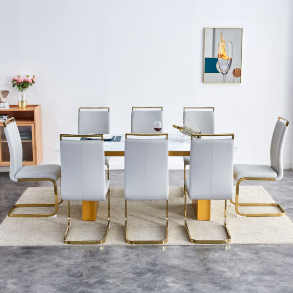 2dacc4d950ff4ad49c09b9c4f7c20b77_703963cff80a2c233f7025fae6d7ebd1 Table and chair set.Large modern rectangular table with 0.4 inch patterned glass tabletop and large MDF table legs.Comes with 8 chairs with faux leather cushioned seats and golden metal legs.