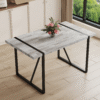A minimalist retro rectangular dining table with a specially textured top and black metal legs.Contemporary Minimalist MDF Gray Textured Tabletop.Able To Give People A Visual Beauty With Rules.