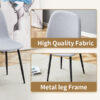 Table and chair set.79"x31.5" with X-shaped Black Metal Table Legs,Wood Grain Textured MDF Crossbeam.Paired With 10 Chairs Made Of Light Gray Lnen Fabric.Iron pipe spraying Legs.