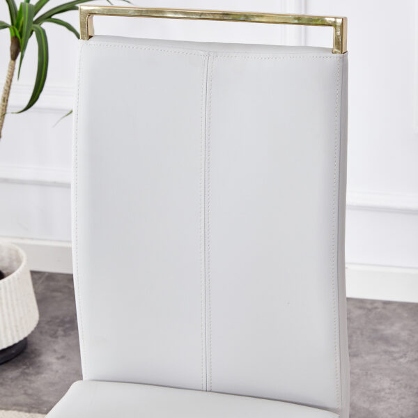 302266937e884485b5a83dfc6bc1d958_34e9d6ac745825b732033cae082e60af Table and chair set.Large modern rectangular table with 0.4 inch patterned glass tabletop and large MDF table legs.Comes with 8 chairs with faux leather cushioned seats and golden metal legs.