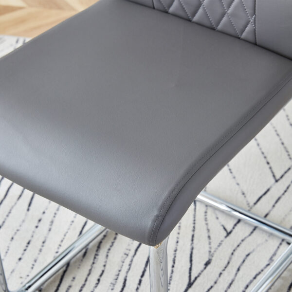 302b8f025ada48ad935aab0f2a3ce839_c97b7ded3512e97555418ea14e09b9c9 Table and chair set.63"x31.5x30" Black Marble-Patterned Slabs Tabletop with Stainless Steel Butterfly Legs.Paried with 4 Dark gray high-quality PU chairs with silver metal legs.