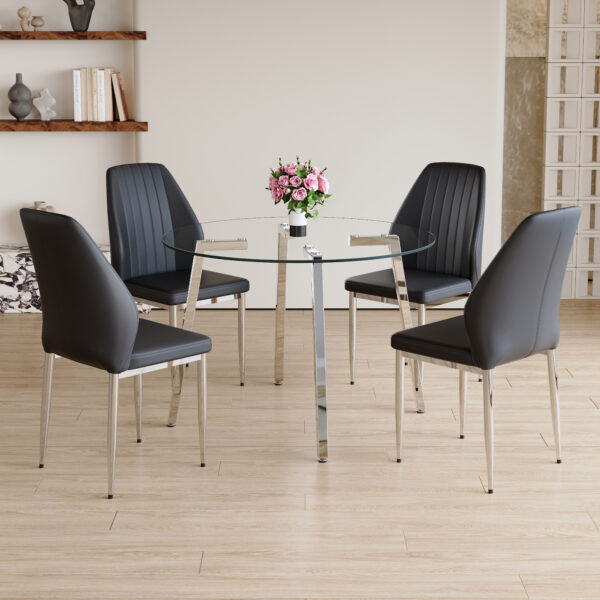 336785347a3f4800a2c87a01c7caf5f6_e5f7d9836363ca2a84df70d944e3e21c Table and chair set.Modern circular transparent tempered glass table, tempered glass tabletop, silver metal table legs.A Set of 4 Black PU Comfort Dining Chairs with extended backrest.