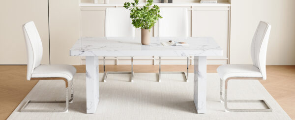 33abdd4de68f45da87aca888684f7a7f_2e0c724023dc8af64dd26b636db3fe64 Table and chair set.63"*35.4" White Imitation Marble Pattern MDF Dining Table Set - 4 Soft and Comfortable White PU Chair With Arched Metal Silver Leg.Create Your Exclusive Low-Key Luxury Space.