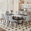 Table and chair set.71*35.4 inch White And Black Spliced Dining Table With Storage Function In The Middle Of The Table Legs.Paired With 8 Light Gray Linen Dining Chairs With Curved Widened Cushion.