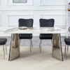 Table and chair set.63"x31.5x30" Luxurious Pandora patterned Sintered Stone Tabletop with Silver Stainless Steel Legs.Paried With 4 Black PU Chairs with a vertical stripe design on the backrest.