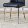 Table and chair set.63"x31.5x30" Black Marble-Patterned Slabs Tabletop with Stainless Steel Butterfly Legs.Paired with 4 Black PU dining chairs with a vertical stripe design on the backrest.