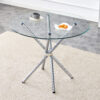Round clear glass dining table with a unique shape for 4-6 people, with ring-shaped gathered silver metal legs, suitable for desks, kitchens, terraces, dining rooms.