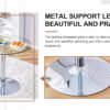 A 35-inch diameter glass top and a modern, minimalist round dining table with silver metal legs. Ideal for dining rooms, living rooms and meeting rooms.