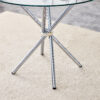 Table and chair set.36.6"Round clear glass dining table with a unique shape with ring-shaped gathered silver metal legs.Paired with 4 Dark gray high-quality PU dining chairs with silver metal legs.