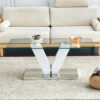 Modern minimalist coffee table. Transparent tempered glass tabletop with silver MDF pillars. Suitable for living room and dining room