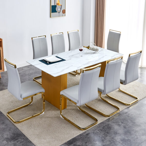3e47c2a74f8e407092b5cdf038b6d859_7f0dc123dab937286a0ad5540ecbc4aa Table and chair set.Large modern rectangular table with 0.4 inch patterned glass tabletop and large MDF table legs.Comes with 8 chairs with faux leather cushioned seats and golden metal legs.