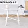 A modern minimalist circular dining table with a 42 inch diameter white patterned tabletop and white metal legs. Suitable for restaurants, living rooms, and conference rooms.