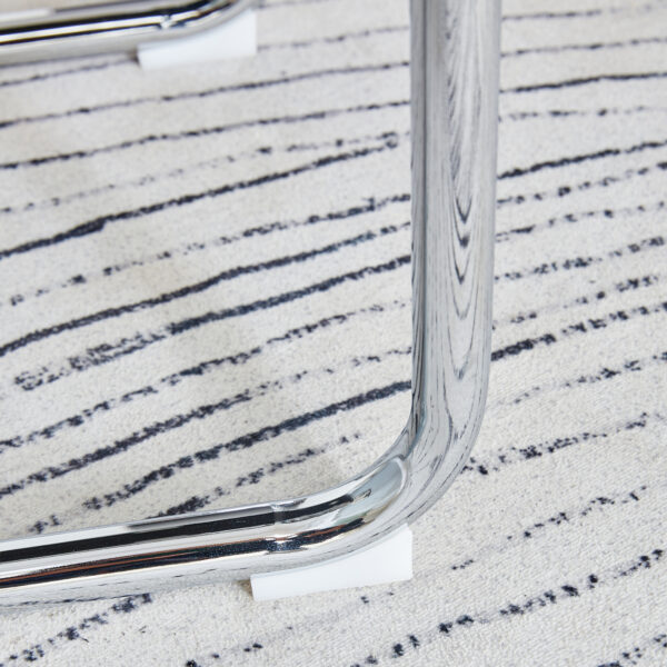 46a02754bdf54b5e9727c49b30680978_40a47ddc8a1fd3529fb296b566538623 Table and chair set.36.6"Round clear glass dining table with a unique shape with ring-shaped gathered silver metal legs.Paired with 4 Dark gray high-quality PU dining chairs with silver metal legs.