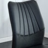 Four black dining chairs. A medieval modern chair made of PU material with soft cushions, equipped with golden metal legs. Suitable for restaurants and living rooms