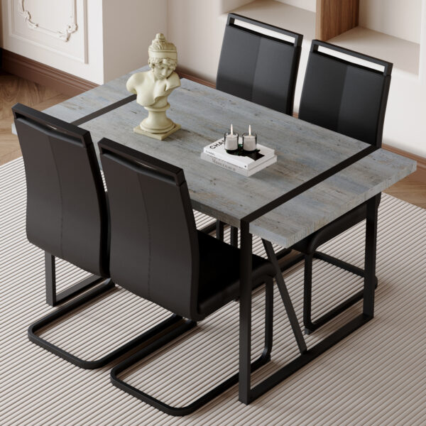 473a0a1f51b84437995eee4480a9dd00_63922084d02f5e864f0144b00a970b91 Table and chair set. Modern minimalist grey marble textured MDF dining table with metal frame.Paired with 4 black PU chairs with Black Featuring arched black legs.