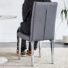2 piece set of gray armless dining chairs brings a touch of elegance and mystery to the dining area with its deep gray tone,The grid and buckle design of the back add a vintage yet fashionable touch