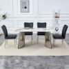 Table and chair set.63"x31.5x30" Luxurious Pandora patterned Sintered Stone Tabletop with Silver Stainless Steel Legs.Paried With 4 Black PU Chairs with a vertical stripe design on the backrest.