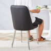 2 modern dining chairs, smooth PU leather backrest and silver-toned metal legs for a comfortable home experience for kitchens, bedrooms and offices.