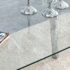 71 * 35.4 inch rectangular dining table. The transparent tempered glass tabletop is paired with silver 7-shaped metal table legs, showcasing a minimalist texture. Suitable for various places.