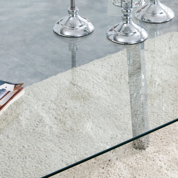 50623f832f6d490f810001f8d3fba0bb_57495a8eeb1fe80214d170d2f3fe7d5e 71 * 35.4 inch rectangular dining table. The transparent tempered glass tabletop is paired with silver 7-shaped metal table legs, showcasing a minimalist texture. Suitable for various places.
