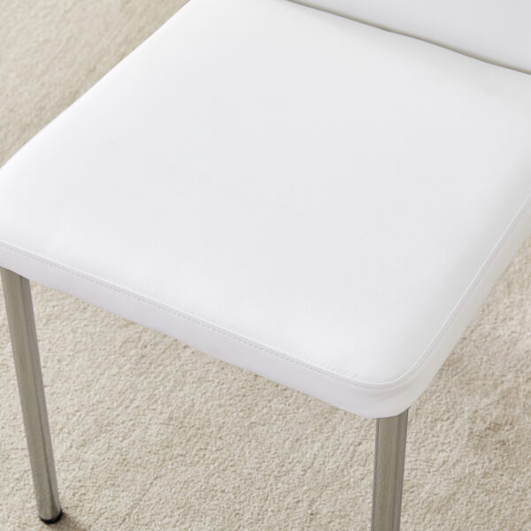 51c4a57fcef8408aa58b112dce8ee52b_83eb2d70586bfbf399bad9366711b1e6 Luxury Simple Chair - Set of 6 White PU Material High Resilience Dining Chair with Metal Silver Leg.The Chair Back Has a Vertical Stripe Design With Smooth And Uniform Lines.
