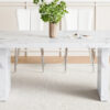 Table and chair set.63"*35.4" White Imitation Marble Pattern MDF Dining Table Set - 4 White PU Chairs with a vertical stripe design on the backrest.Create Your Exclusive Low-Key Luxury Space.