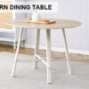 A modern and minimalist circular dining table with a 42 inch diameter wood colorer patterned tabletop and white metal legs. Suitable for restaurants, living rooms, and conference rooms.