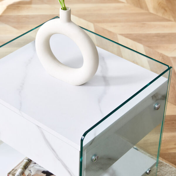 598ead9c729c4c8a8d2224ea7fa7e21c_840069795c05975c66be25a5b2947a37 Bedside table with drawers. The board surface is MDF sticker, and both sides are transparent tempered glass. The design is simple and elegant, with excellent storage functions.