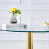 A 35-inch diameter glass top and a modern, minimalist round dining table with gold metal legs. Ideal for dining rooms, living rooms and meeting rooms.