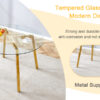 Modern Luxurious Round Tempered Glass Dining Table with Gold 7-Shaped Metal Legs,suitable for family meals, office conferences, or as a casual coffee table for various occasions.47.3*47.3*29.5